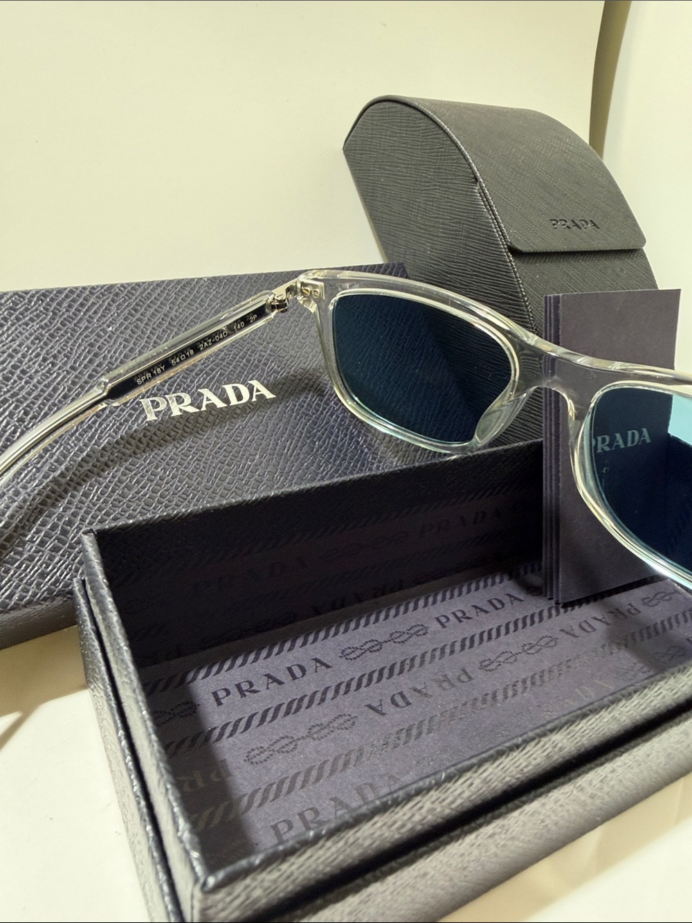 Prada Clear Frame Sunglasses with Blue Lenses - Picture 3 of 5